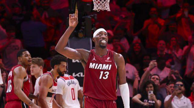 Miami Heat center Bam Adebayo (13) reacts after becoming the second highest scorer for points per game in NBA history during the second half of a basketball game against the Washington Wizards on March 10, 2026, at Kaseya Center in Miami.